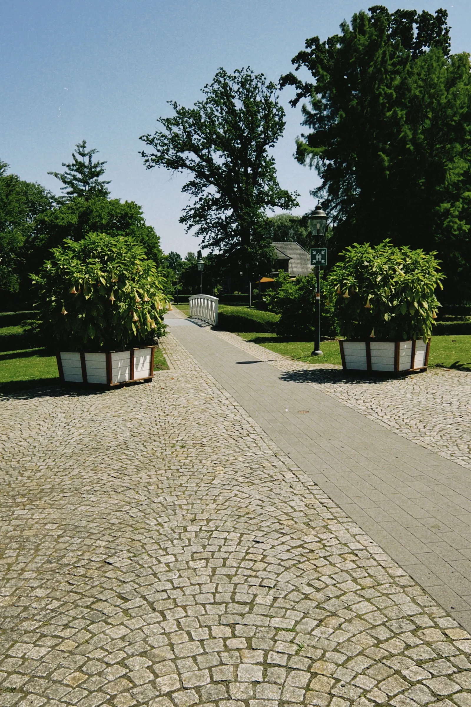 Geometric concrete paver patio with a clean stacked-bond grid layout and modern outdoor furniture