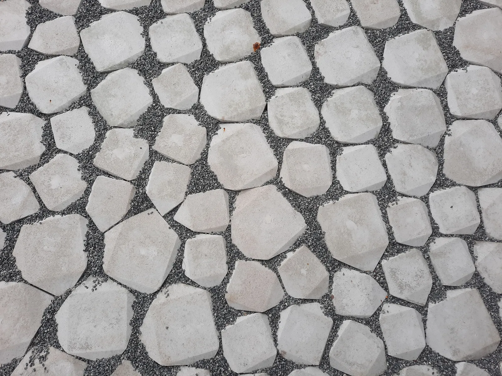 Interlocking concrete paver patio with tight joints sitting level on a compacted base