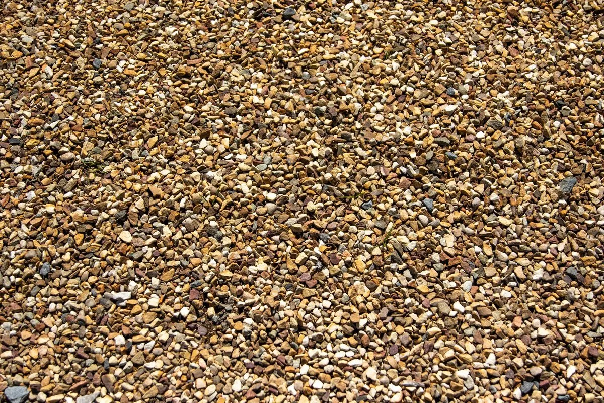 Close-up of crushed stone gravel base layer for a paver patio foundation