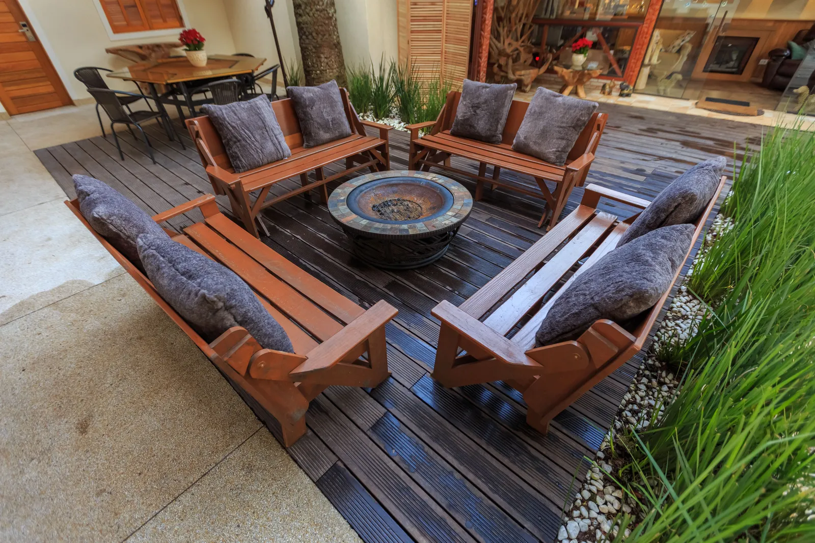 Circular paver patio around a stone fire pit with radiating fan courses