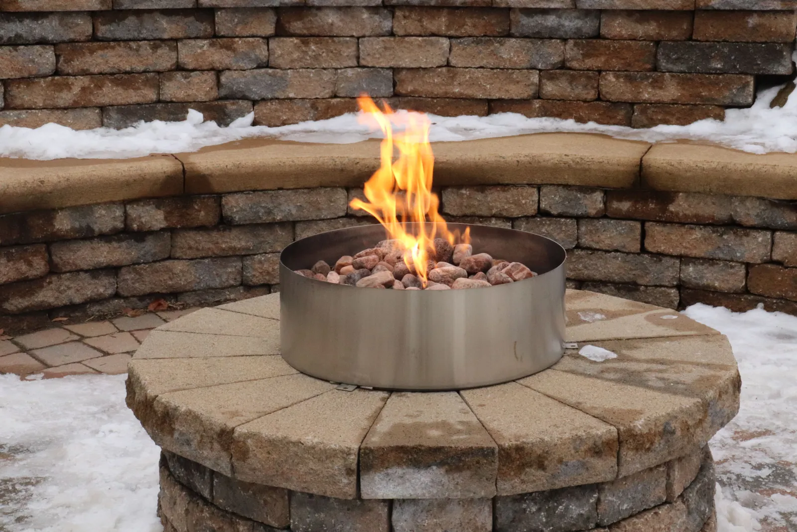 Rectangular paver patio with a dedicated circular fire pit zone
